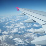 The clouds and wing from the aircraft.