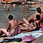 Sunbathing on the Beach Sunbathing on the Beach
