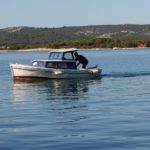 Small Boat At Sea