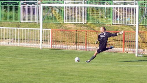 Goalkeeper Kicking The Ball