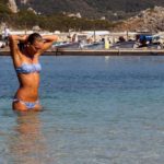 Woman Holding Her Hair In The Sea Free image: Girl In The Sea
