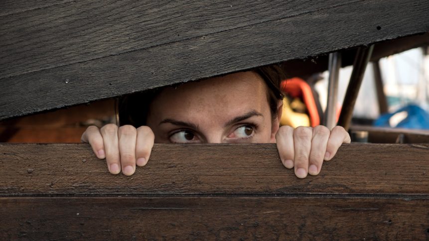 Woman playing hide and seek | Copyright-free photo (by M. Vorel