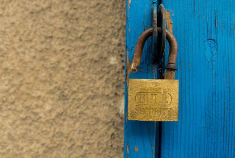 Old door and an open padlock Old door and an open padlock