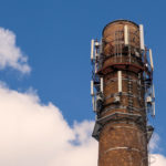 Old brick chimney with mobile phone antennas Free photo: Old brick chimney with antennas