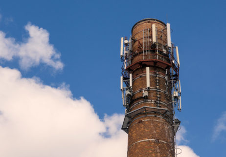Old brick chimney with mobile phone antennas Old brick chimney with mobile phone antennas