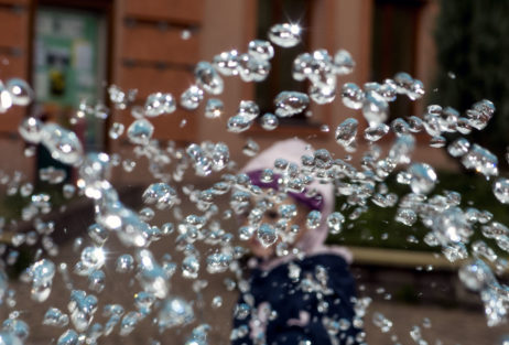 Child behind the water drops Child behind the water drops