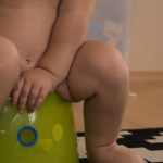 Baby sitting on potty Free photo: Baby sitting on potty