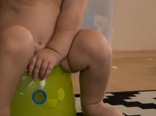 Baby sitting on potty