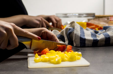 Hands cutting vegetables Hands cutting vegetables
