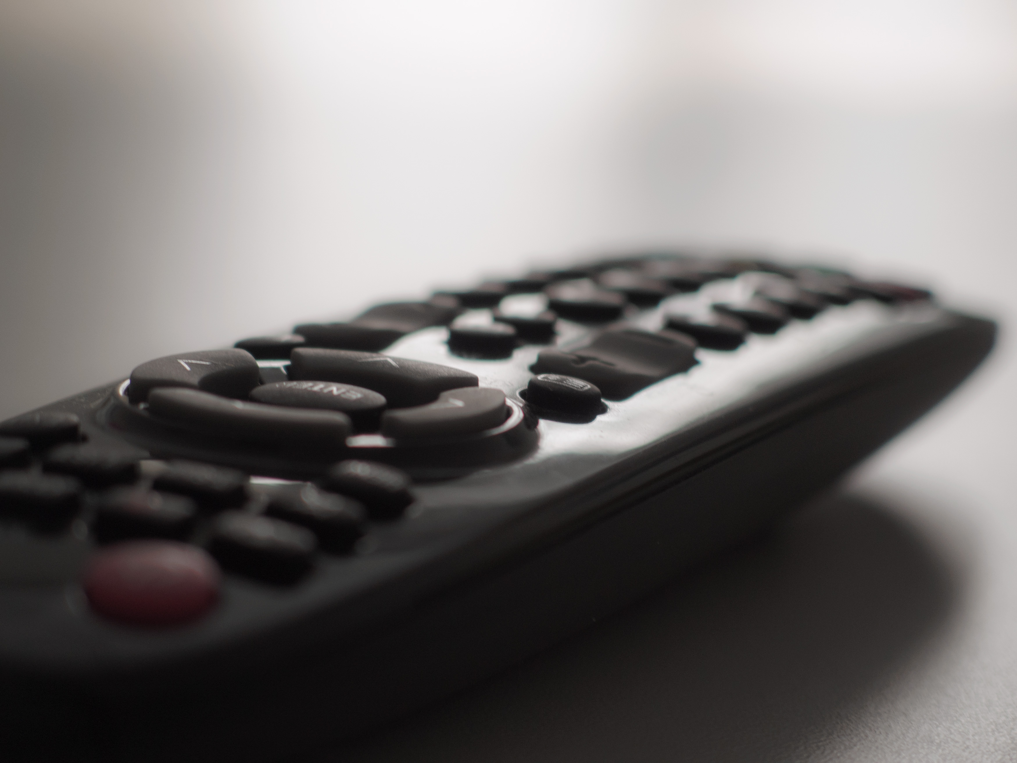 Close up macro photography of a smart tv television remote control with  recording button. Concept of show, business, recording, tv, action, and  radio Stock Photo