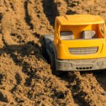 Plastic toy car on the playground Plastic toy car on the playground | Free Stock Photo
