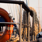 Railing, rope and lifebuoy on yacht Railing, rope and lifebuoy on yacht | Free Stock Photo