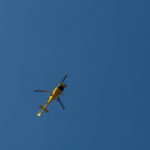Helicopter flying in the blue sky