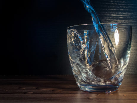 Water is poured into the glass Water is poured into the glass