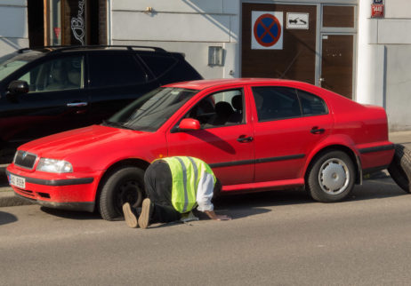 Man changing the punctured tyre Man changing the punctured tyre