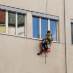 Window washer on a climbing rope Image of window washer on a climbing rope