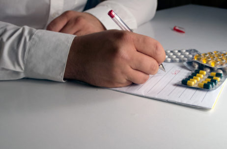 Doctor writes a prescription Doctor writes a prescription