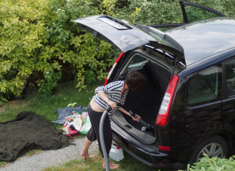 Woman cleaning her car Woman cleaning her car