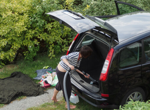 Woman cleaning her car