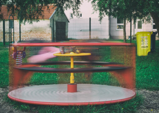 Kids On Children’s Playground Carousel