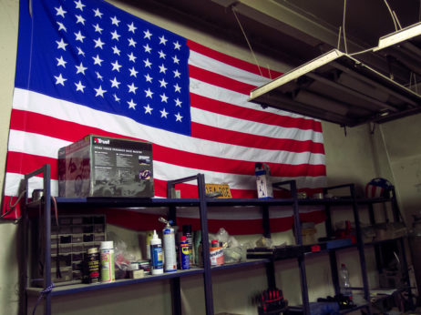 American Flag On The Wall Of Car Repair Shop American Flag On The Wall Of Car Repair Shop