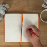 Hand Writing To Open Blank Notebook Mockup
