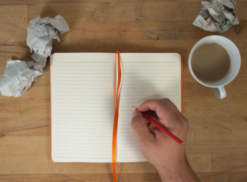 Hand Writing To Open Blank Notebook Mockup