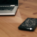 Laptop And Smartphone On Wooden Table