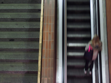Woman On Moving Staircase Woman On Moving Staircase