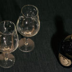 Two Glasses And Bottle Of Red Wine On Black Background Two Glasses And Bottle Of Red Wine On Black Background