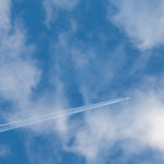 Airplane On The Cloudy Sky