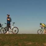 Three Bikers On The Top The Hill