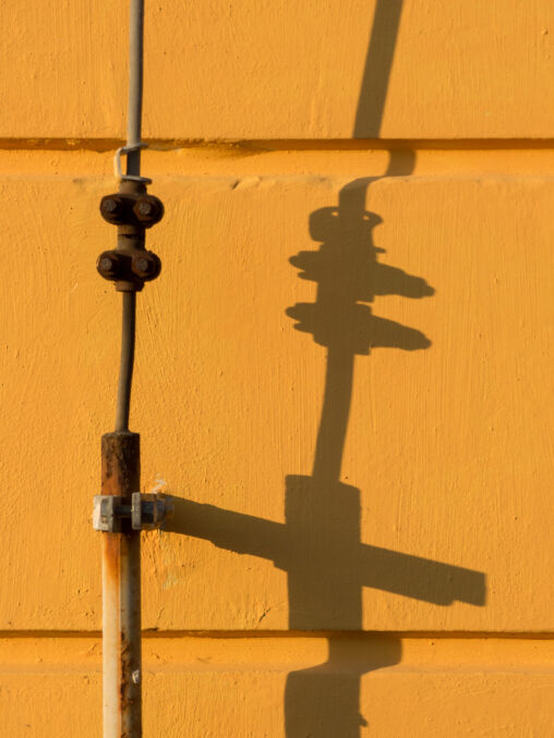 Lightning Rod Shadow On Yellow Wall