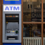 Three young women and ATM | Free Stock Photo | LibreShot