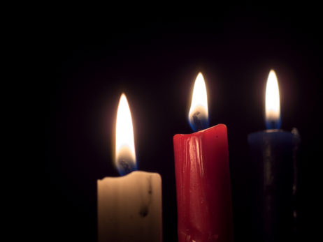 Three candles on a black background Three candles on a black background