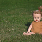 Vintage doll on the grass Vintage doll on the grass
