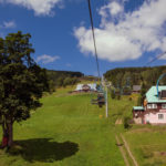 Chair Lift Above The Green Meadow chair lift above the green meadow