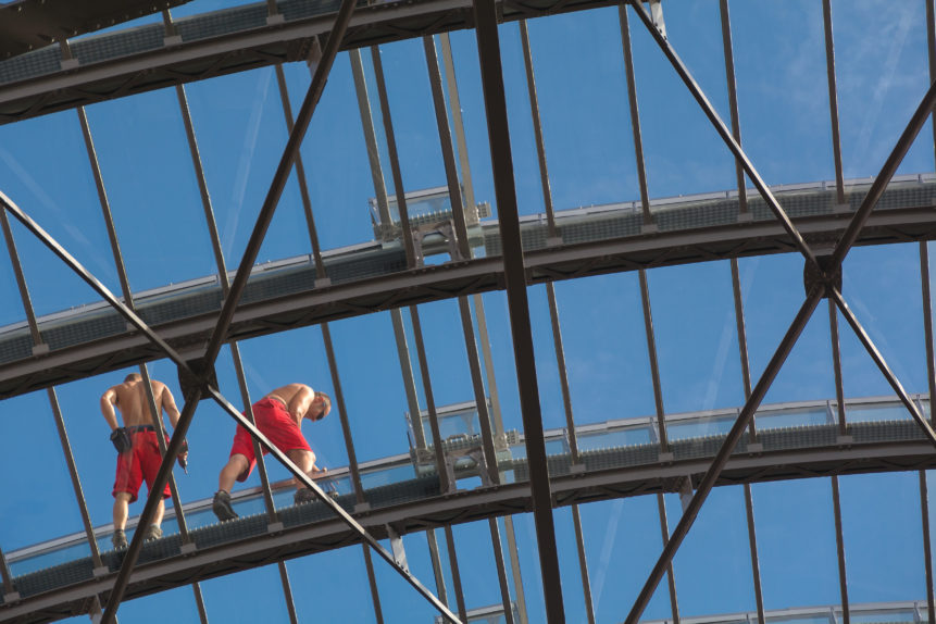 Workers on the glass roof