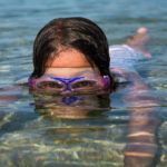 Little girl swimming in the sea