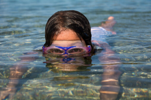 Little girl swimming in the sea
