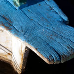 White and blue wooden boat with wood texture Detail of white blue wooden boat
