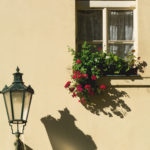 Prague street lamp and window with flowers Prague street lamp