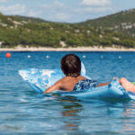 children on inflatable sunbed