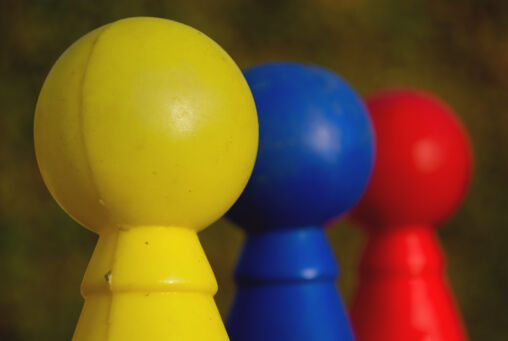 Three Colored Plastic Skittles