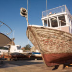 An old fishing boat in dry dock