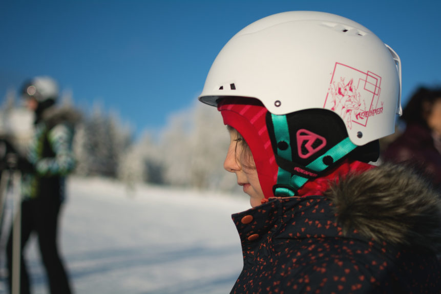 Little girl in a ski helmet