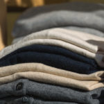 Folded luxury sweaters in the shop