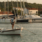 Two Men on Wooden Boat in Croatia Men on wooden boat in croatia