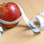 Apple and Measuring Tape Apple and measuring tape