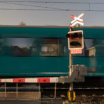 Railroad crossing with train